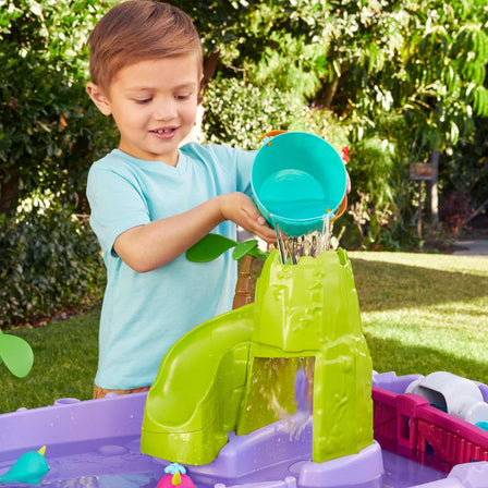 Mermaid Island Wavemaker™ Water Table - 
Pour water with the bucket to create a waterfall.