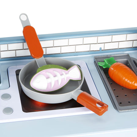 First Prep Kitchen™ - 
The stovetop lights up when kids push the burner buttons.