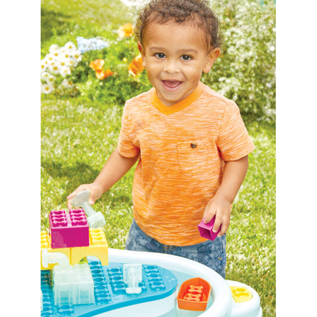 Build & Splash™ Water Table with 50+ Accessories - 
A built-in moat with drainage plug allows for optional water play. 
