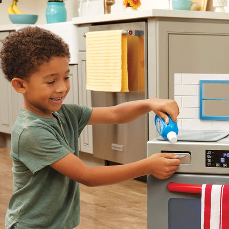 First Dishwasher - 
Features a working door, a sliding detergent drawer, removable dish racks and a drying mat.