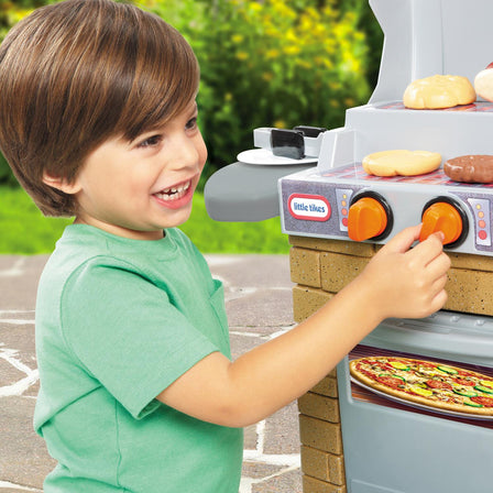 Cook 'n Play Outdoor BBQ™ - 
Clicking knobs on grill make fun sounds.