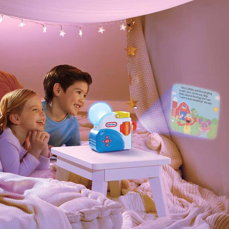 Story Dream Machine™ Sesame Street® Elmo & Friends Story Collection - 
Watch, listen, and read along as each story magically unfolds with colorful lights and sound effects.
